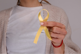 Woman holding endometriosis awareness ribbon