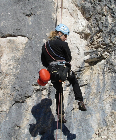Person abseiling down a cliff