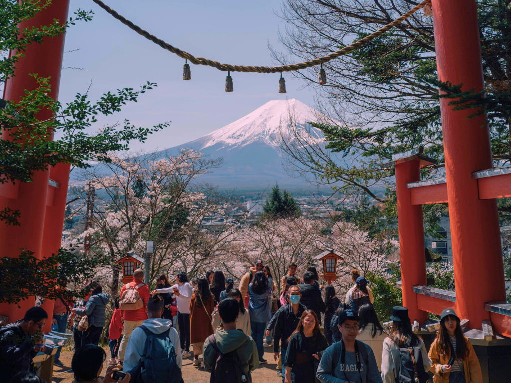 Crowds visit Arakurayama Sengen Park during Japan’s cherry blossom season, with Mount Fuji and sakura trees in the background