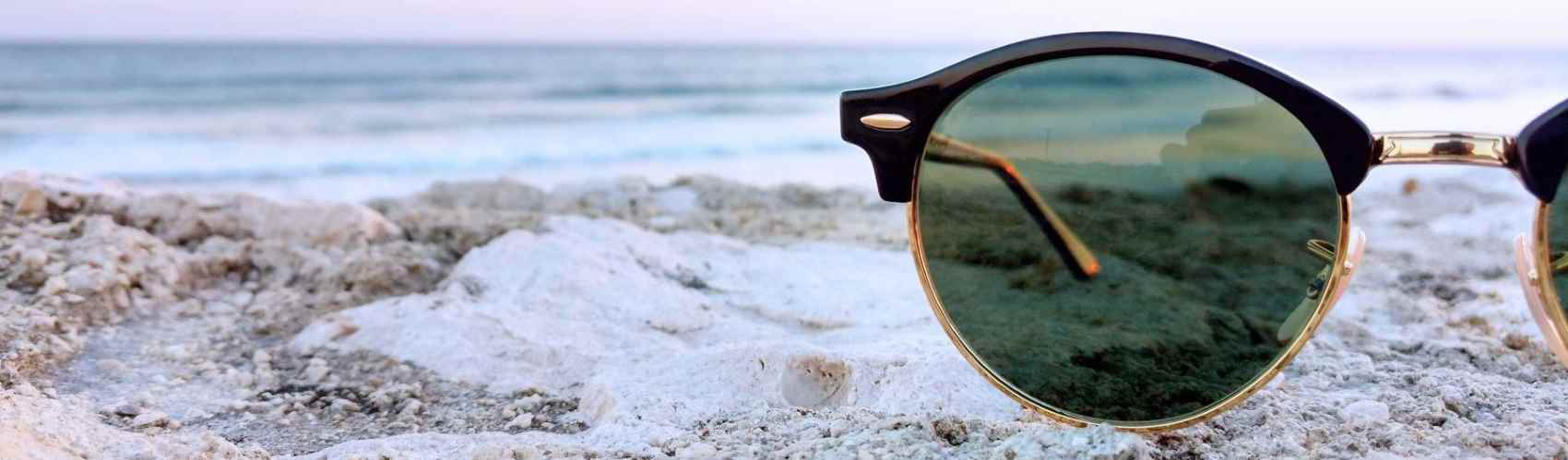 sunglasses in sand