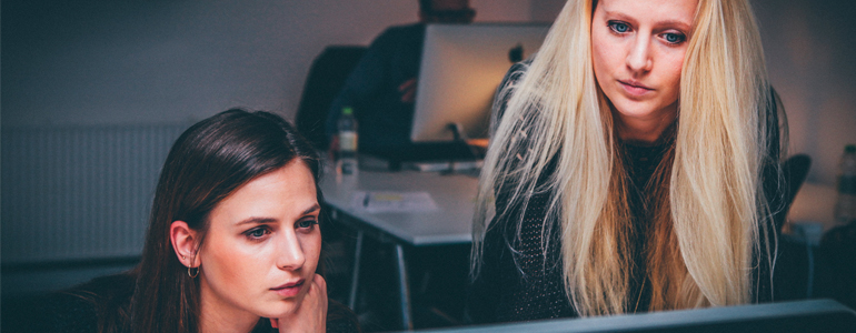 Two Women Looking at Computer