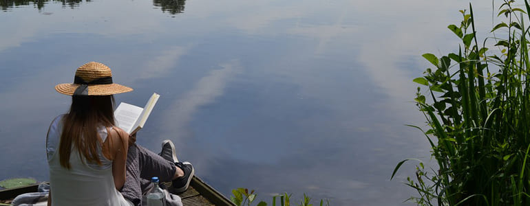 Woman Reading by Lake