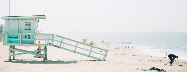 blue grey wooden beach cottage during day time