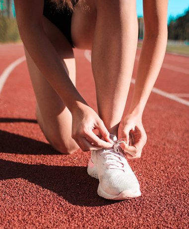 Athletes sprinting on a track
