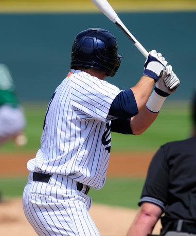Baseball player batting in a game