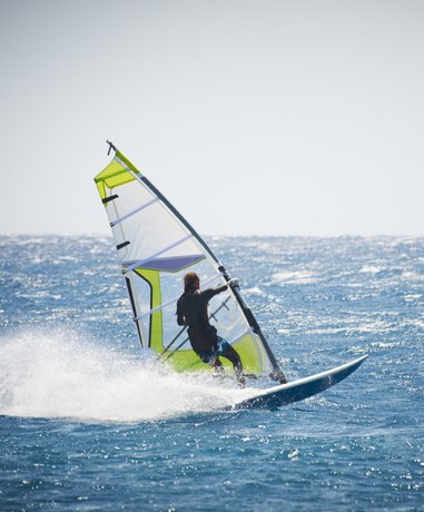 Boardsailer in action on the water