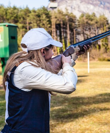 Clay pigeon shooter in action