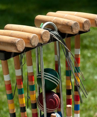 Croquet player in action on the lawn