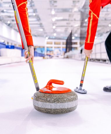 Curling players in action on the ice