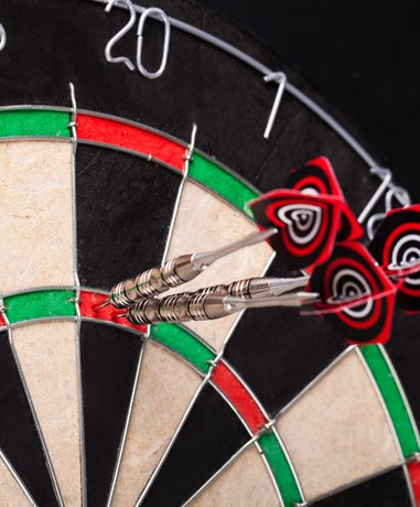 Darts player in action