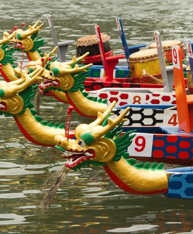 Dragon boat teams racing in a river