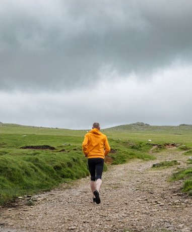 Fell runner in action on a mountain trail