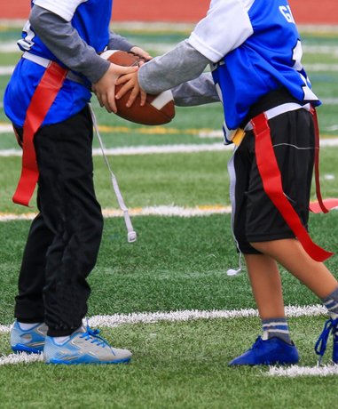 Flag football player running with the ball