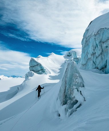 Skier descending a glacier