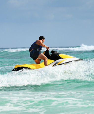 Jet Ski rider speeding across the water
