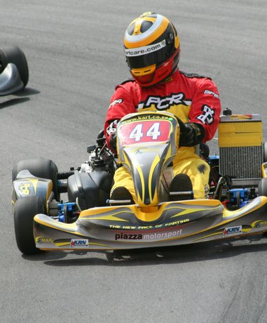 Karting driver in action on a track