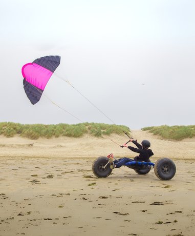 Kite Buggying in action on a beach