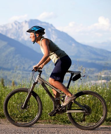 Mountain biker riding on a challenging trail