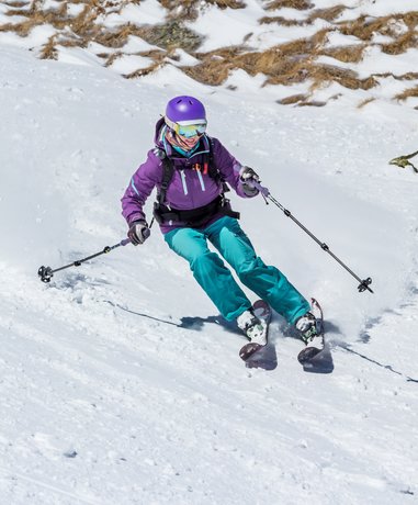 Skier in deep snow off-piste