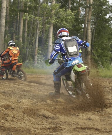 Off road motorcyclist riding on a dirt track