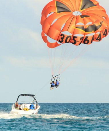 Parasailer soaring over the ocean