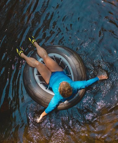 People enjoying river tubing