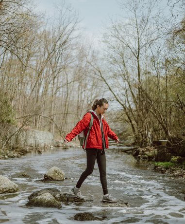 River walker navigating through a rocky river