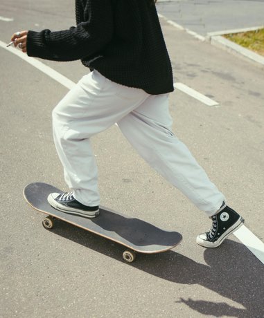 Skateboarder performing a trick in an urban setting