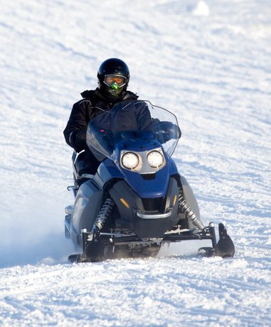 Ski Doo rider in snowy landscape