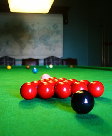 Snooker player aiming at ball