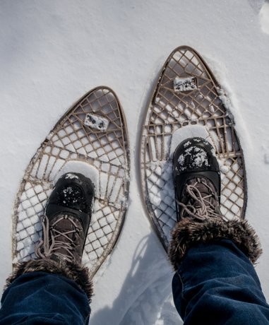 Snow shoe walker in winter gear