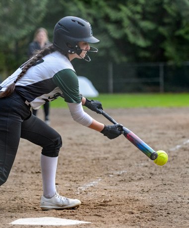 Softball player batting