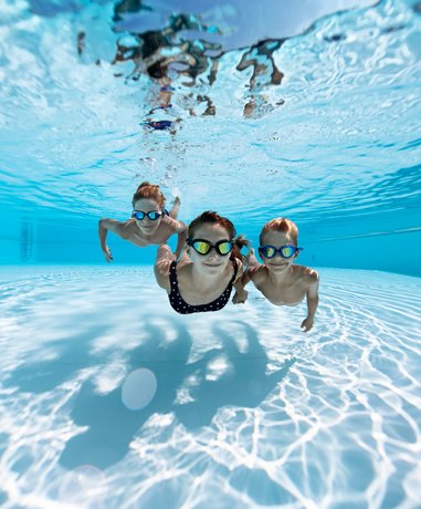 Swimmer in open water with safety gear