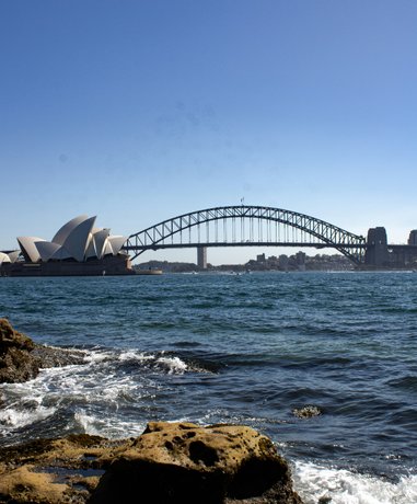 Person walking across Sydney Harbour Bridge