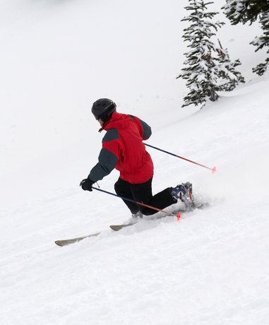 Telemarking skier in action on snowy slope