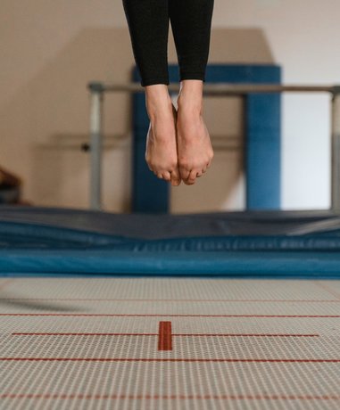 Trampolining athlete performing in mid-air