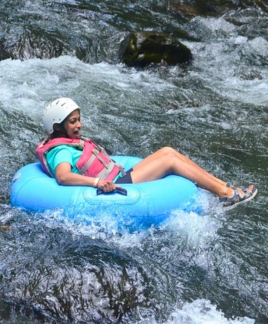 Tubing enthusiast riding down a river