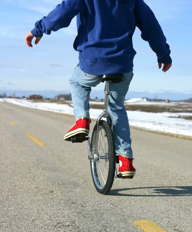 Unicycle rider performing tricks